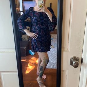 Small, floral print, mini dress. 3/4 bell sleeves with lace.